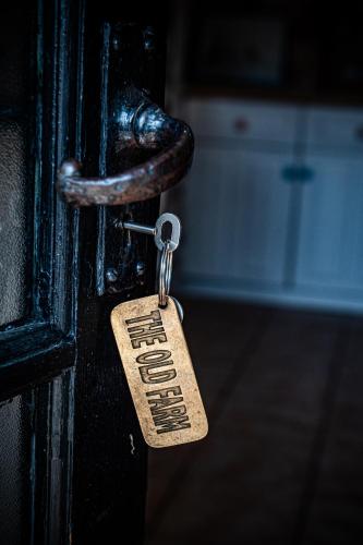 a door latch with a door tag on it at The Old Farm in Gloucester