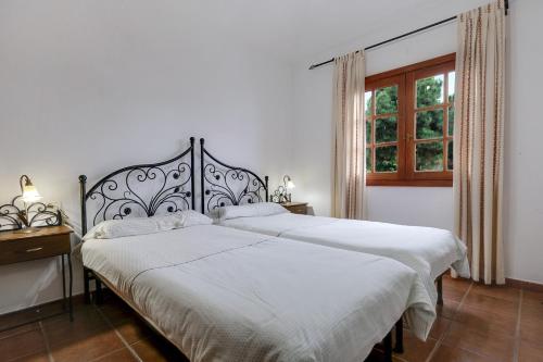 Ένα ή περισσότερα κρεβάτια σε δωμάτιο στο Finca La Sorriba