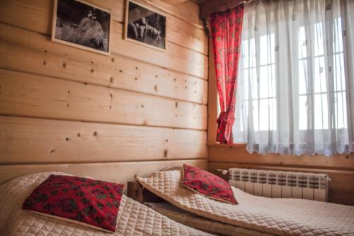 Ein Bett oder Betten in einem Zimmer der Unterkunft Pokoje pod Grapą