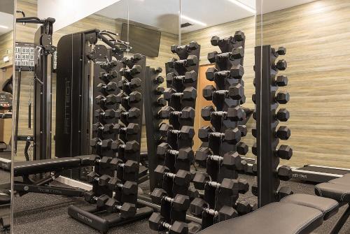 a gym with rows of squat racks at The Leaf Boutique Hotel Lisbon - Adults Only in Lisbon
