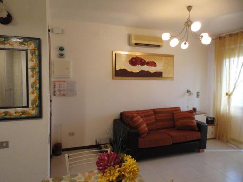 a living room with a couch and a table at Fede & Francy in Quartu SantʼElena