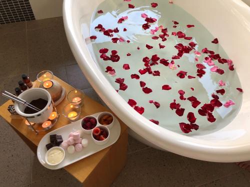 a bathroom with a cake with hearts on it at Somewhere Unique in Wollombi