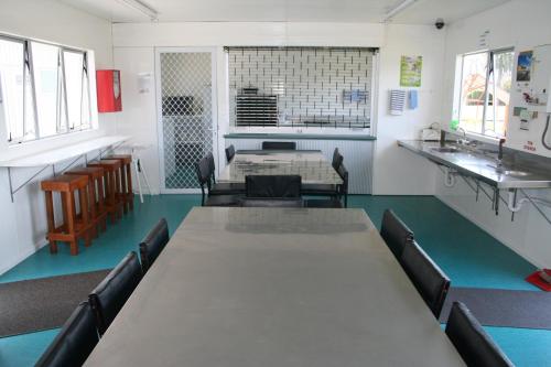 a classroom with a table and chairs in a room at Levin TOP 10 Holiday Park in Levin