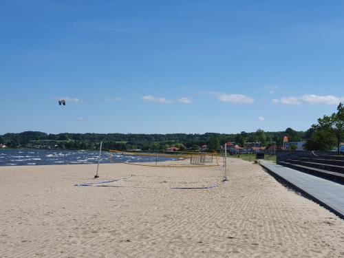 a beach with volleyball nets in the sand at Hotel Østersø in Aabenraa