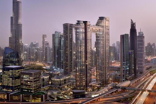 a large city with many tall buildings and highways at Address Sky View in Dubai