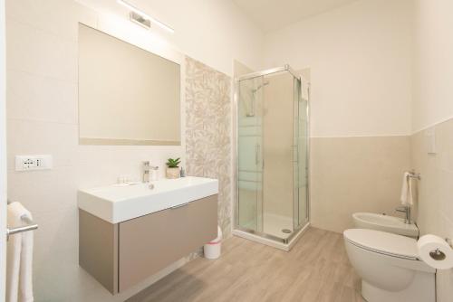 a bathroom with a sink and a shower and a toilet at Nel Conero Affittacamere in Numana
