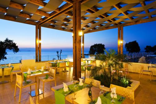 A restaurant or other place to eat at Oceanis Beach & Spa Resort