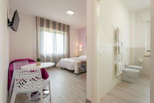 Katil atau katil-katil dalam bilik di Nel Conero Affittacamere