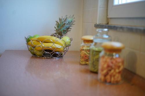 a bowl of fruit sitting on top of a counter at Apartment Jardin with free cowered parking in Zadar