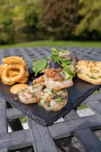 a plate of food on a picnic table at Innishannon House Hotel in Inishannon