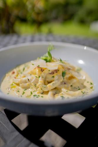 a white plate of food on a table at Innishannon House Hotel in Inishannon