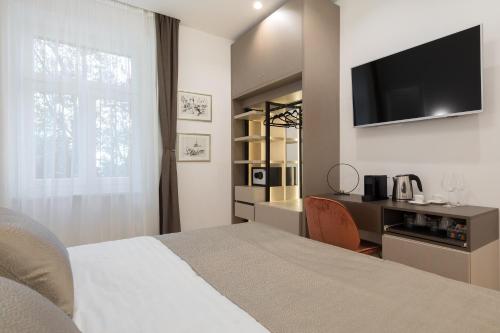 Postel nebo postele na pokoji v ubytování Green Park Luxury Rooms