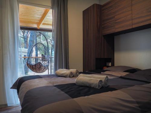 Posteľ alebo postele v izbe v ubytovaní Lux camp - mobile homes in Bi village