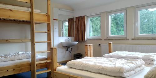 Postel nebo postele na pokoji v ubytování Flambacher Mühle