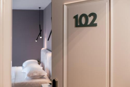 a room with a door with a number on it at ODA Aparthotel Shkodër in Shkodër
