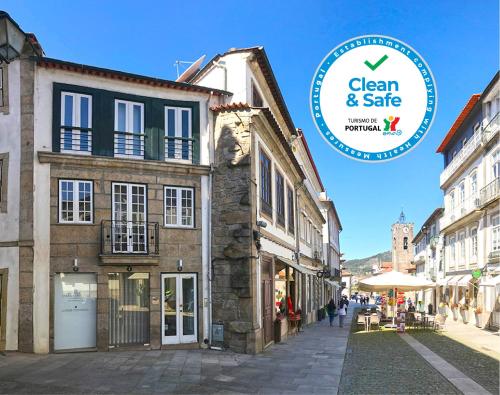 a building with a sign that says clean and safe at Casa da Travessa in Ponte de Lima