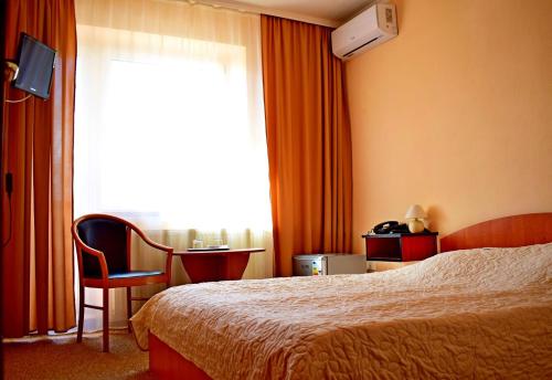 Een bed of bedden in een kamer bij Hotel Complex Vizit