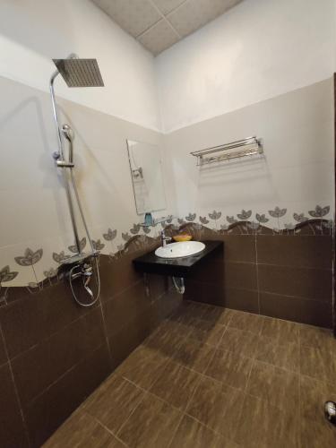 a bathroom with a sink and a shower at Sa Pa New Villa in Sapa