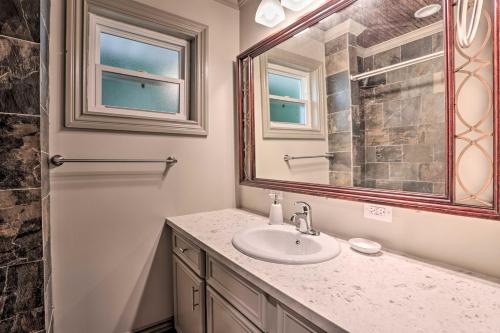 a bathroom with a sink and a mirror at Lake Charles Home 1 Mi to Public Boat Launch in Lake Charles