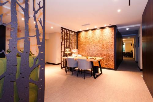 a dining room with a table and chairs at The Leaf Boutique Hotel Lisbon - Adults Only in Lisbon
