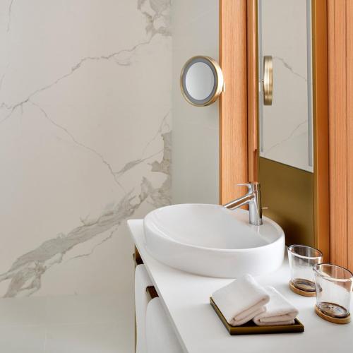 a bathroom with a white sink and a mirror at Vida Creek Harbour in Dubai
