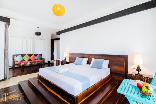 Letto o letti in una camera di Tra Que Mansion