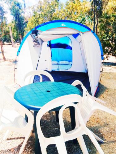 a table and chairs in front of a tent at Camping la Naranja in Gandía
