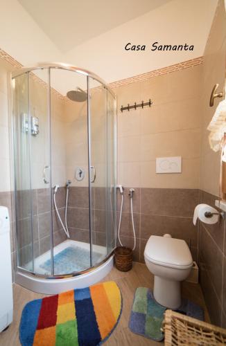 a bathroom with a shower and a toilet at A & B Holiday Home in Deiva Marina