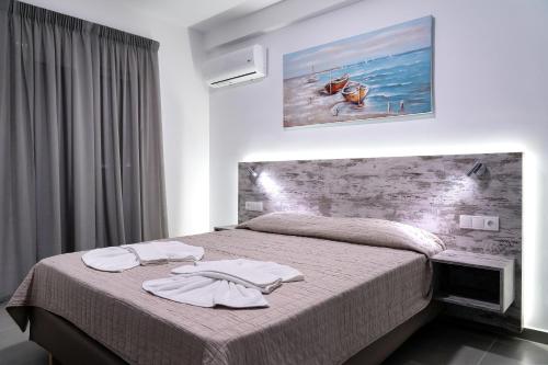 Ένα ή περισσότερα κρεβάτια σε δωμάτιο στο Aegean Horizon apartments