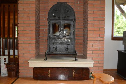 an old fashioned stove in a brick wall at Vila Mira Zlatar in Nova Varoš