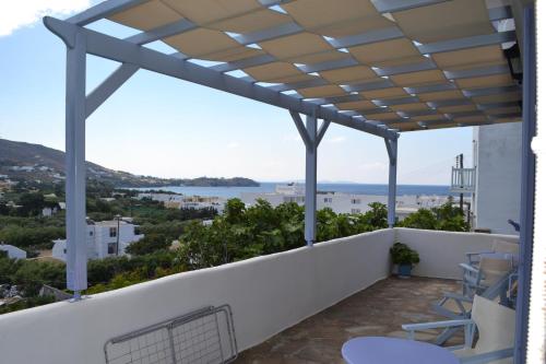 a balcony with a view of the ocean at Studio Ioanna Tinos in Kionia
