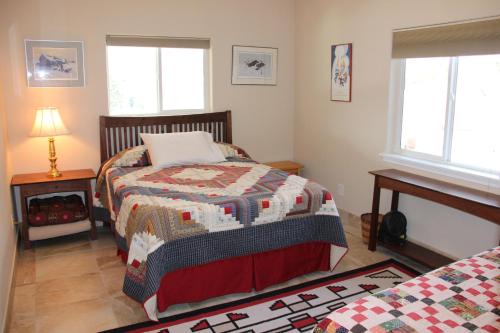 a bedroom with two beds and two windows at Pleasant Valley in Rice
