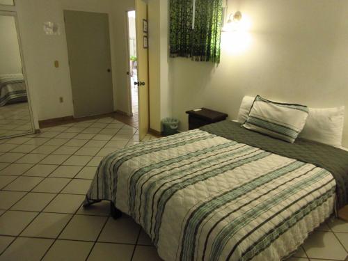 Cama o camas de una habitación en Alexandross Hostel