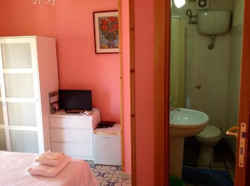 a bathroom with a sink and a toilet and a shower at Villa Lembo in Agnone