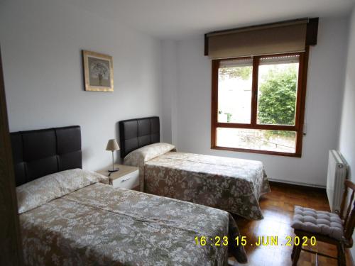 A bed or beds in a room at Apartamento Anjana