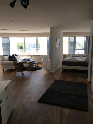 a living room with a couch and a table at Apartment 6, OG 3 in Schleswig