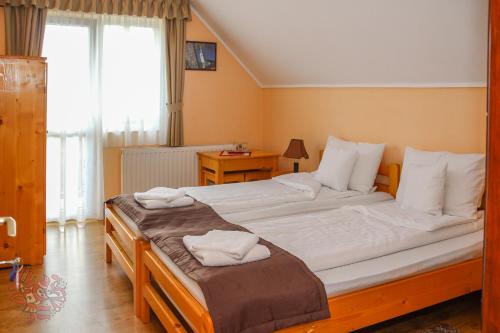 Un ou plusieurs lits dans un hébergement de l'établissement Sóvidék Guesthouse