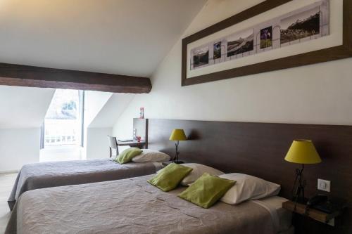 Postel nebo postele na pokoji v ubytování Hôtel d'Ossau