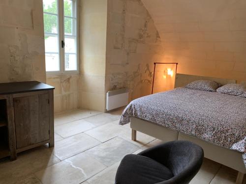 Voodi või voodid majutusasutuse Gite de la Tour des Abbés toas