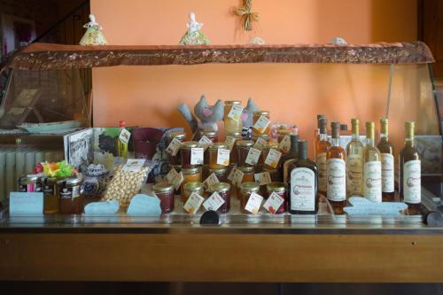 a display of bottles of wine on a counter at All'Ombra del Castello in Cigliè