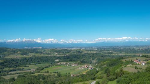 an aerial view of a valley with mountains in the background at All'Ombra del Castello in Cigliè