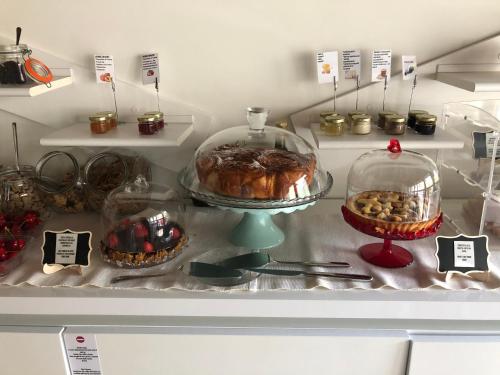a display of pastries and other desserts in a refrigerator at La terrazza sulle vigne B&B in Corte Franca