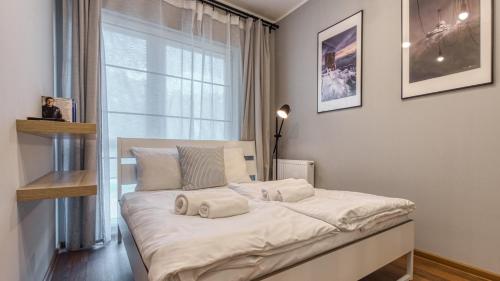 Giường trong phòng chung tại Apartament Nastrojowy-Holiday Mountain Residence - 5D Apartamenty