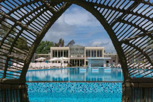 a view of the swimming pool at a resort at Plana Resort & SPA in Castel Volturno