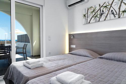 Ένα ή περισσότερα κρεβάτια σε δωμάτιο στο Aegean Horizon apartments