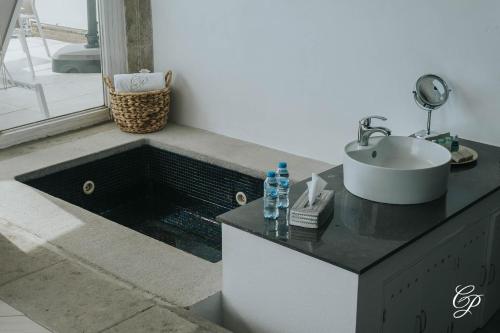 a bathroom counter with a sink and a sink at Hotel Boutique de Cantera Y Plata in Taxco de Alarcón