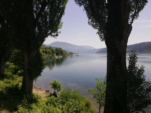 a view of a lake with mountains in the distance at Lucashof Millstättersee in Millstatt