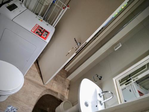 a bathroom with a toilet and a sink at Amazing Studio in Recoleta in Buenos Aires