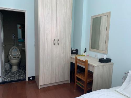 Cama o camas de una habitación en 穀鄉民宿