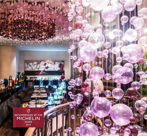 a room with a bunch of bubble balloons hanging from the ceiling at Hotel Eclat Taipei in Taipei